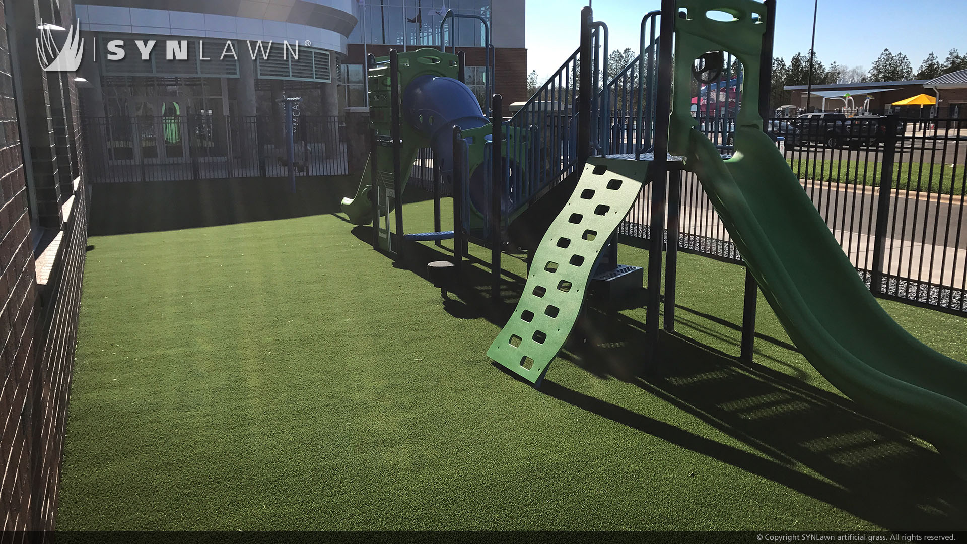 Green playground grass installed on artificial grass