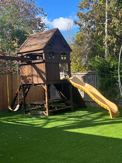 backyard-playground-installation-synlawn SYNLawn backyard artificial grass playground lawn